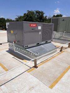 A large Bryant brand rooftop HVAC unit installed by Modern Air Services in Fort Worth, TX.