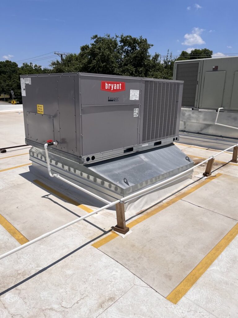 A large Bryant brand rooftop HVAC unit installed by Modern Air Services in Fort Worth, TX.