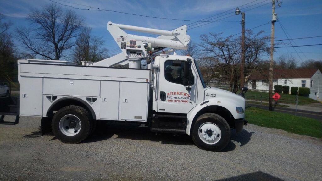 A white bucket truck used for electrical services by Andrews Electric Services in Knoxville, TN