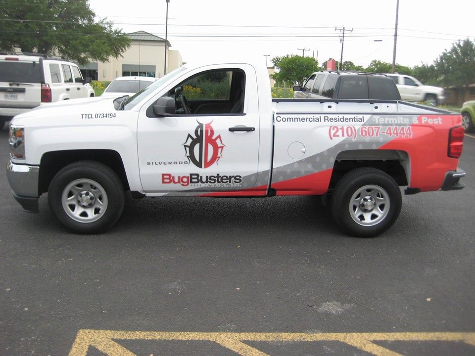 A branded Bug Busters Pest Control service truck parked in San Antonio, TX, ready for residential and commercial pest control jobs.