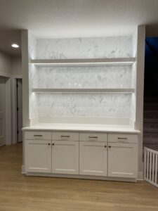 Custom built-in shelving with integrated LED strip lighting installed by Silverline Electric LLC in Kennewick, WA.