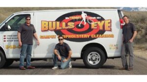 The Bullseye Carpet & Upholstery Cleaning crew standing proudly with their service van, ready to serve clients in Boise, ID.