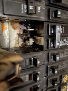 A burnt circuit breaker indicating an electrical fault, requiring repair by Phoenix Electric, Inc. in Cape Coral, FL