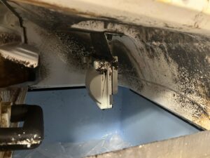 A close-up of a burnt electrical component inside a commercial refrigeration unit, serviced by Commercial Kitchen Services, LLC of Watertown, SD.