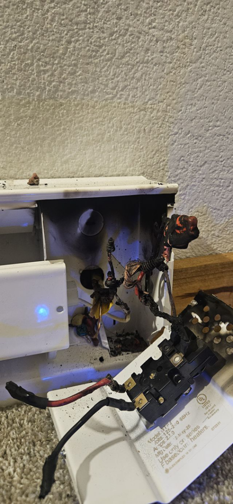 A close-up of a burnt and damaged electrical component, indicating an electrical fault, addressed by 715 Electric LLC in Eau Claire, WI.