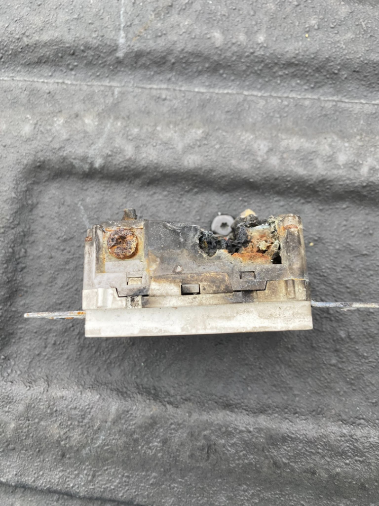 A severely burnt electrical component requiring repair from Southern Electrical Services, LLC in Leesburg, VA.