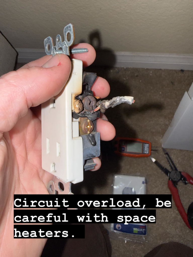 A burnt electrical outlet showing signs of circuit overload, a common issue fixed by AO Electric Inc. in Sacramento, CA.