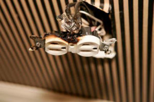 A close-up of a burnt electrical outlet needing repair, a service provided by M/C Electric in Lexington, SC.