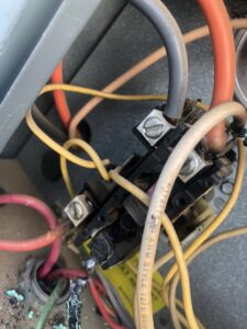 Burnt wiring and a damaged contactor inside an HVAC unit, requiring service from All Metro Air Conditioning in Apache Junction, AZ.