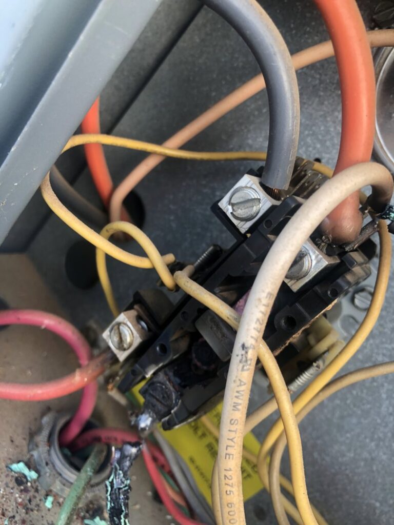 Burnt wiring and a damaged contactor inside an HVAC unit, requiring service from All Metro Air Conditioning in Apache Junction, AZ.