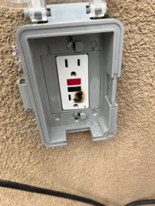 A burnt outdoor electrical outlet requiring repair from Bonafide Electrical Services in Denham Springs, LA.