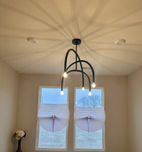 Custom built-in cabinets with elegant interior strip lighting installed by VIP Electrical Services in Naperville, IL.