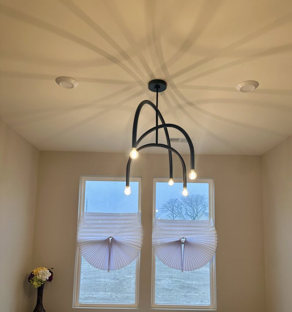 Custom built-in cabinets with elegant interior strip lighting installed by VIP Electrical Services in Naperville, IL.