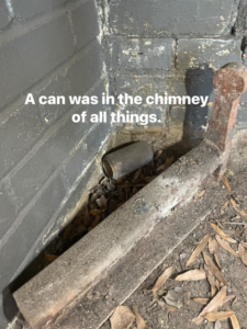 A discarded can and leaves found inside a dirty fireplace during a chimney cleaning by Southern Chimney and Duct Clean in Monroe, LA.