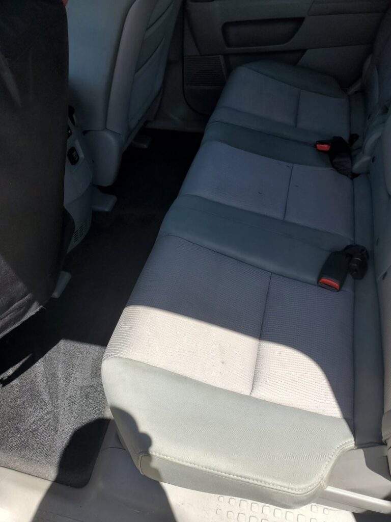 Cleaned carpet floor mats and seats in a car interior, showcasing auto carpet cleaning by A Plus Carpet Cleaning in Lawton, OK.