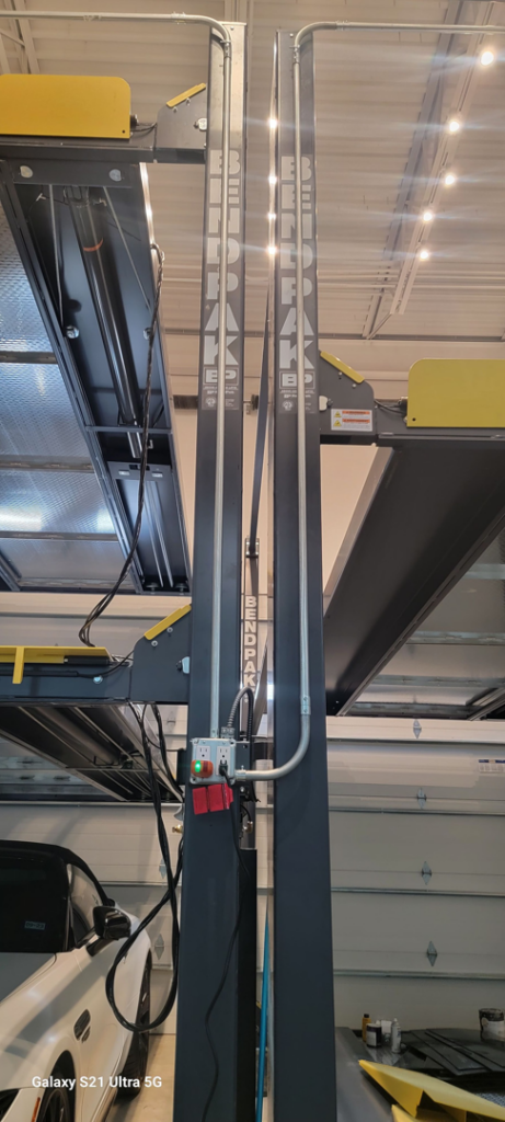 Electrical wiring and control box installation for a car lift by Kross Homes & Security in Dallas, TX