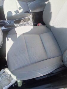 Professional car seat upholstery cleaning in progress, showing a clean car interior by Carpets Dirty in Phoenix, AZ