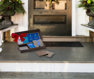 A sample box containing carpet and other flooring options on a doorstep from Westcraft Flooring in Denver, CO.