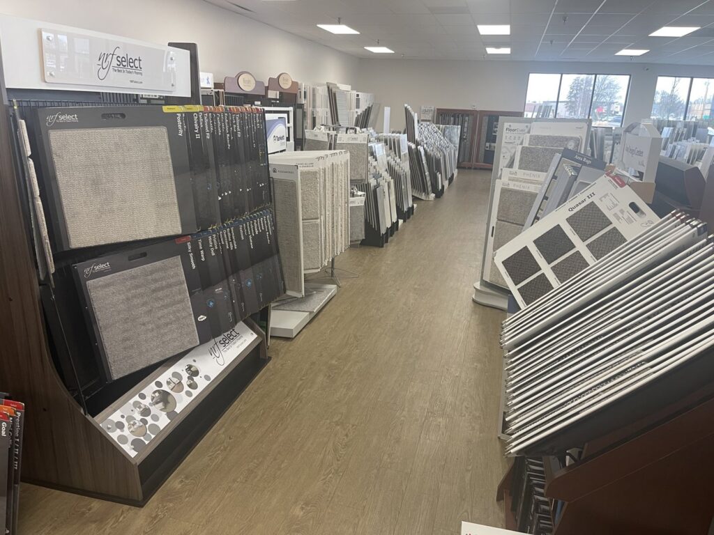 Various carpet and flooring samples displayed in the showroom at Spectrum Tile & Carpet, Inc. in Fall River, MA
