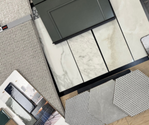 A flat lay of various carpet and flooring samples for selection at Westcraft Flooring in Denver, CO.