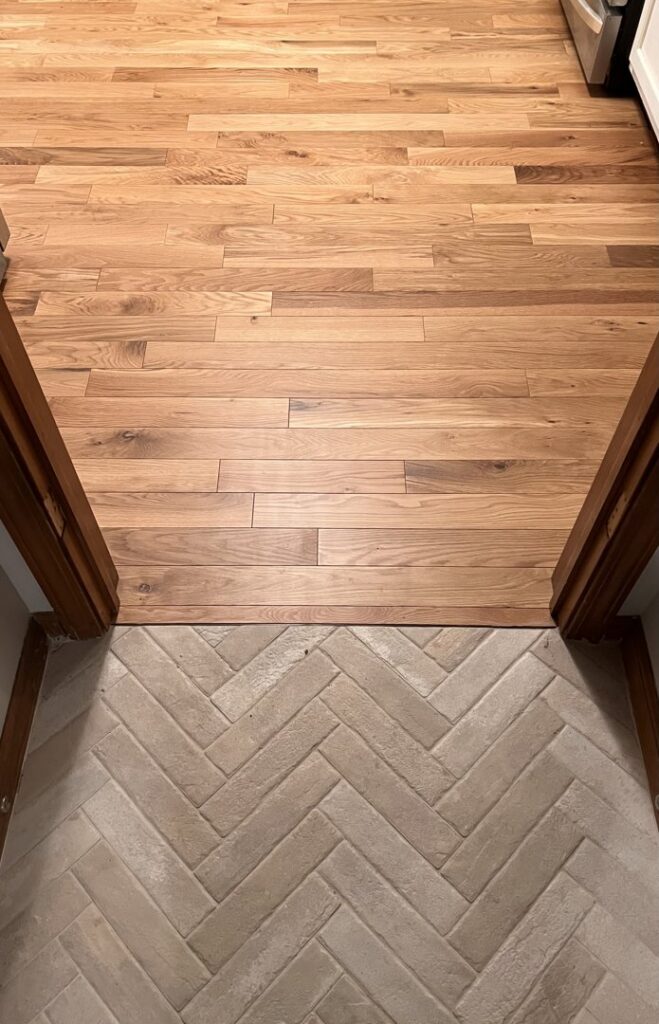 An expansive showroom featuring various carpet and flooring options at Custom Floors in Fishers, IN