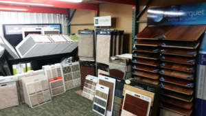 A showroom displaying various carpet and hardwood flooring samples at M&S Flooring Inc. in Ardmore, TN.
