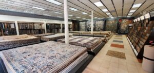 A wide view of the United Carpet showroom, displaying a large selection of carpets and rugs in Rochester, NY.