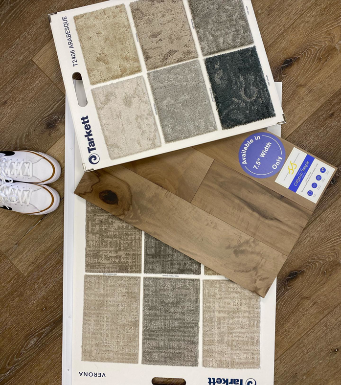 Various carpet and wood flooring samples displayed for selection at CC&S Flooring in Salt Lake City, UT.