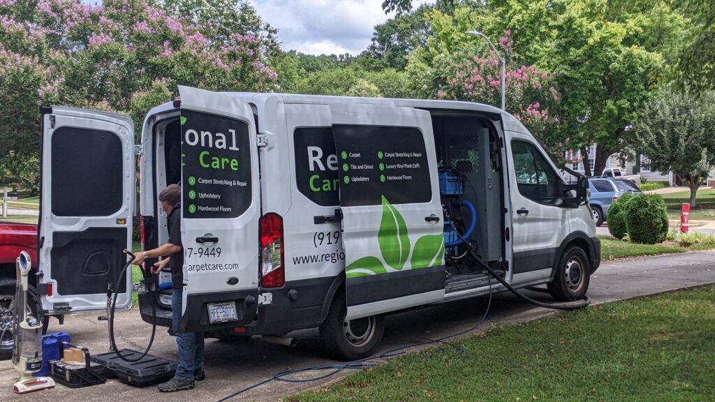 A Regional Carpet Care service van with equipment and hoses ready for a job in Garner, NC.