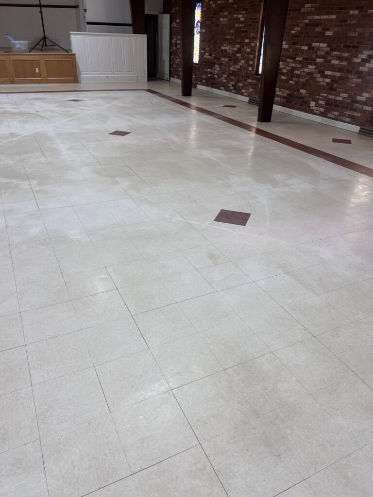 A clear before and after comparison showing a cleaned section of carpet by ProTech Carpet Care in Greensboro, NC.