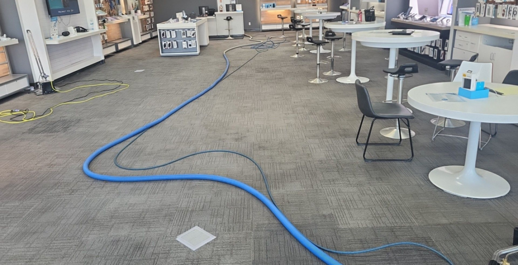 Carpet cleaning equipment with hoses laid out in a commercial space by Leiter's Carpet Cleaning in Fort Wayne, IN.