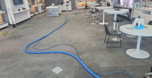 Carpet cleaning equipment with hoses laid out in a commercial space by Leiter's Carpet Cleaning in Fort Wayne, IN.