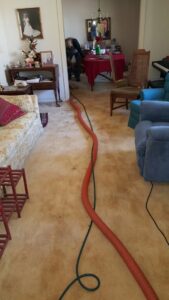 Carpet cleaning equipment and hoses in use during a job by ALL Services of NC in Greensboro, NC