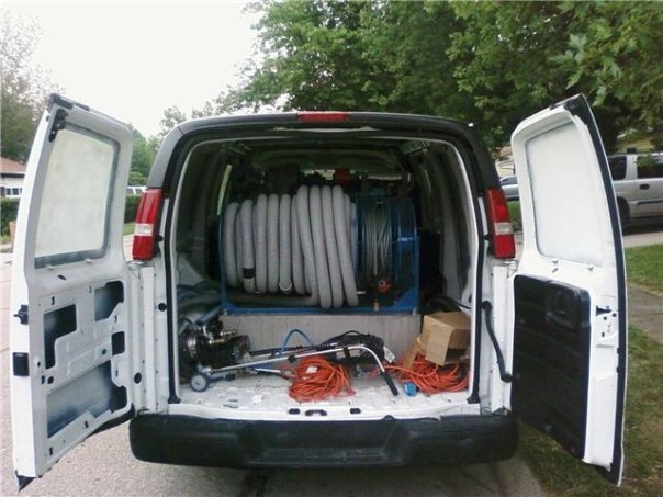 Professional carpet cleaning equipment, including hoses and machines, stored inside a service van for HutchPro Carpet Cleaning Plus in Indianapolis, IN.