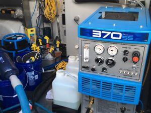 Professional carpet cleaning equipment, including a 370SS machine, organized inside a North County Carpet Cleaning van in Vancouver, WA