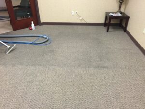 Professional carpet cleaning wand and hoses laid out on a carpeted floor by C&C Carpet Care LLC in Columbia, MO.