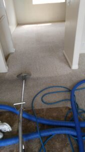 Carpet cleaning equipment in a residential room by Performance Carpet & Floor Services in West Jordan, UT.