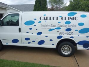 Carpet cleaning equipment and protective mats prepared in a residential hallway by St.Louis Carpet Clinic in St. Charles, MO.