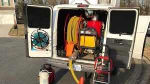 A professional carpet cleaning equipment setup in the back of a service van by DCSfloorcleaning in Charlotte, NC
