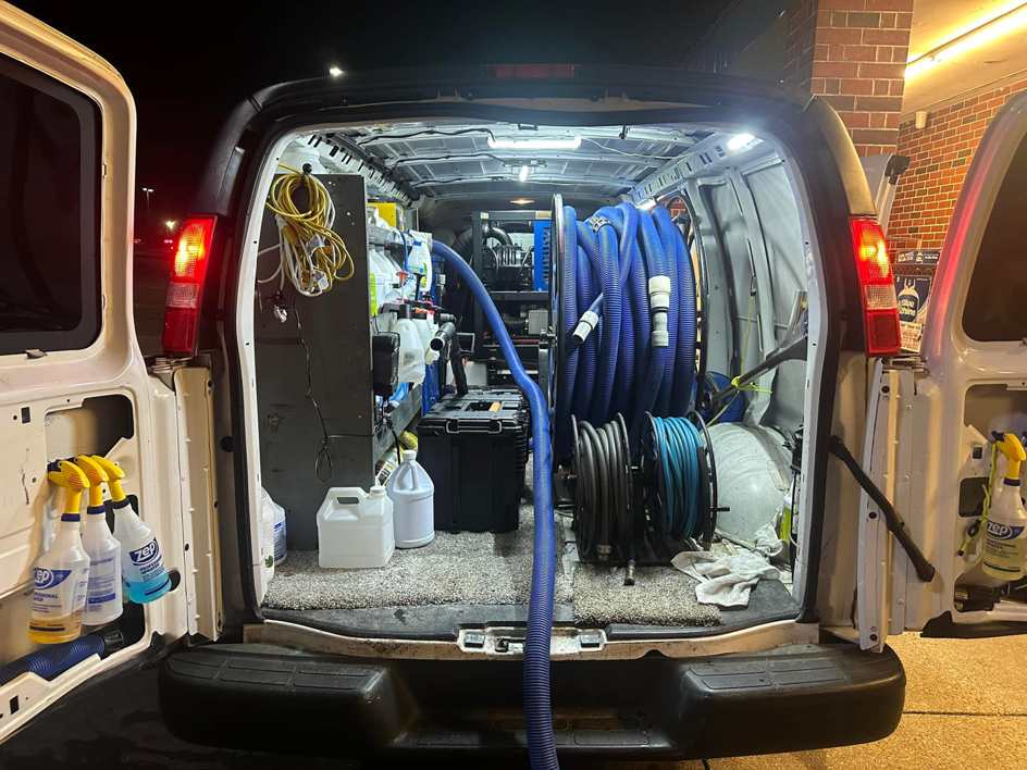 Carpet cleaning hoses and supplies loaded in a service van for Evolution Clean Care in Knoxville, TN