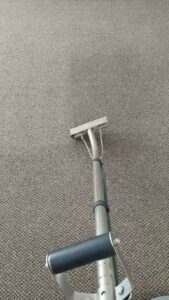 A carpet cleaning wand in action, demonstrating professional carpet cleaning by Advanced Carpet Cleaning in College Station, TX
