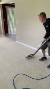 Carpet cleaning in progress showing before and after results by S&J Carpet Care in Oswego, IL