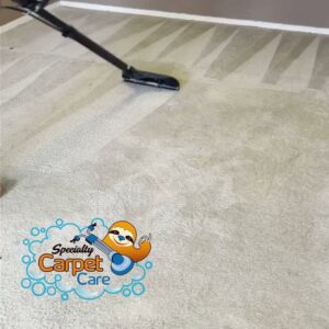 A carpet cleaning wand in action, showing a clear before-and-after difference on a light carpet by Specialty Carpet Care in Surprise, AZ