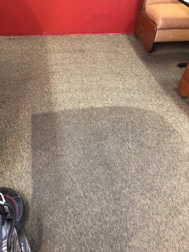 A carpet cleaning in progress, showing a clean strip next to a dirty area by Clean Rite Janitorial & Pressure Washing in Bend, OR.