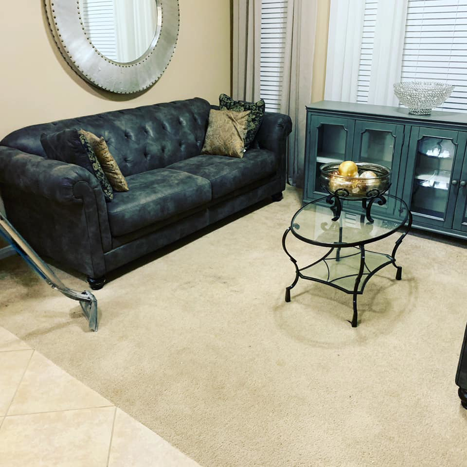 Professional carpet cleaning in progress in a living room by Kustom Carpet Kare in Houston, TX