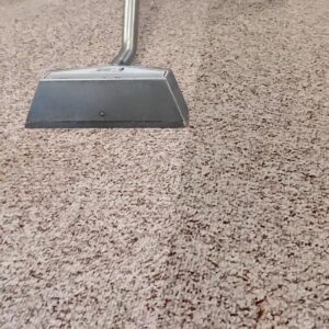 A close-up of a carpet cleaning wand creating a clean strip on a carpet by Referral Cleaning and Restoration Inc. in Fort Wayne, IN.