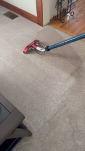 A professional cleaning wand in action, deep cleaning a carpet by Restore Carpet Care and Tile in Tallahassee, FL