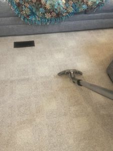 A carpet cleaning wand in action, showing a clean path on a residential carpet by Zerorez Wichita in Wichita, KS.