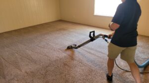 A professional performing a carpet cleaning job with a steam cleaner at Jake's Steamer the Carpet Cleaner in Seminole, TX