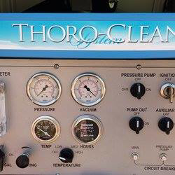 Close-up of a carpet cleaning machine's control panel with gauges and switches at Extra Mile Floor Care in Mesa, AZ.